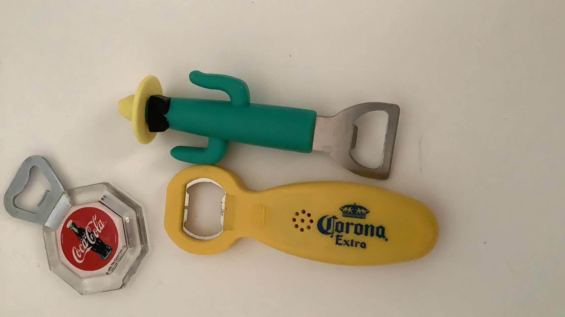 Photo 1 of ASSORTED BOTTLE OPENERS AND BUTTER KNIVES AND MAGNETS