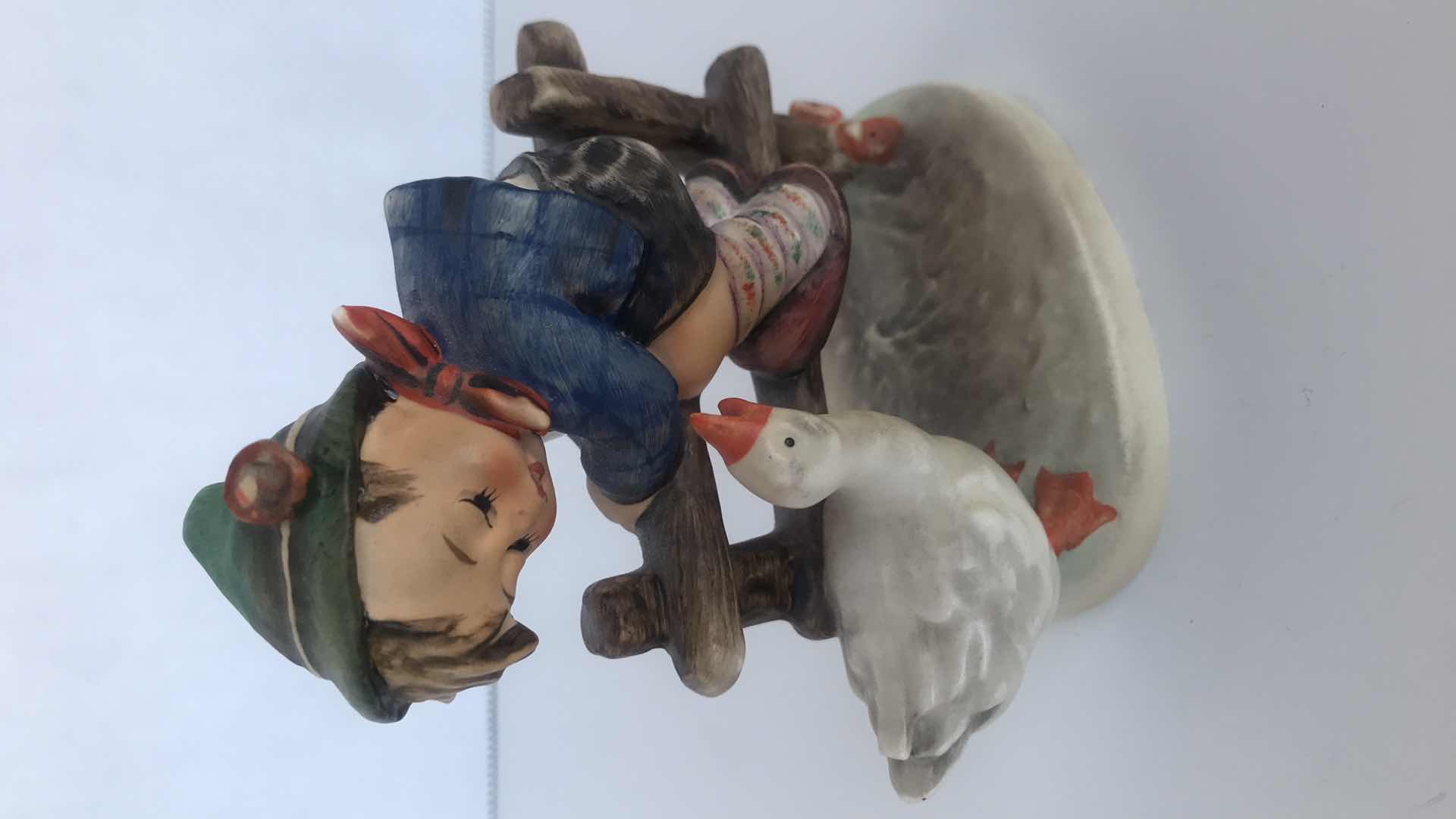 Photo 1 of HUMMEL BOY ON FENCE BESIDE DUCK