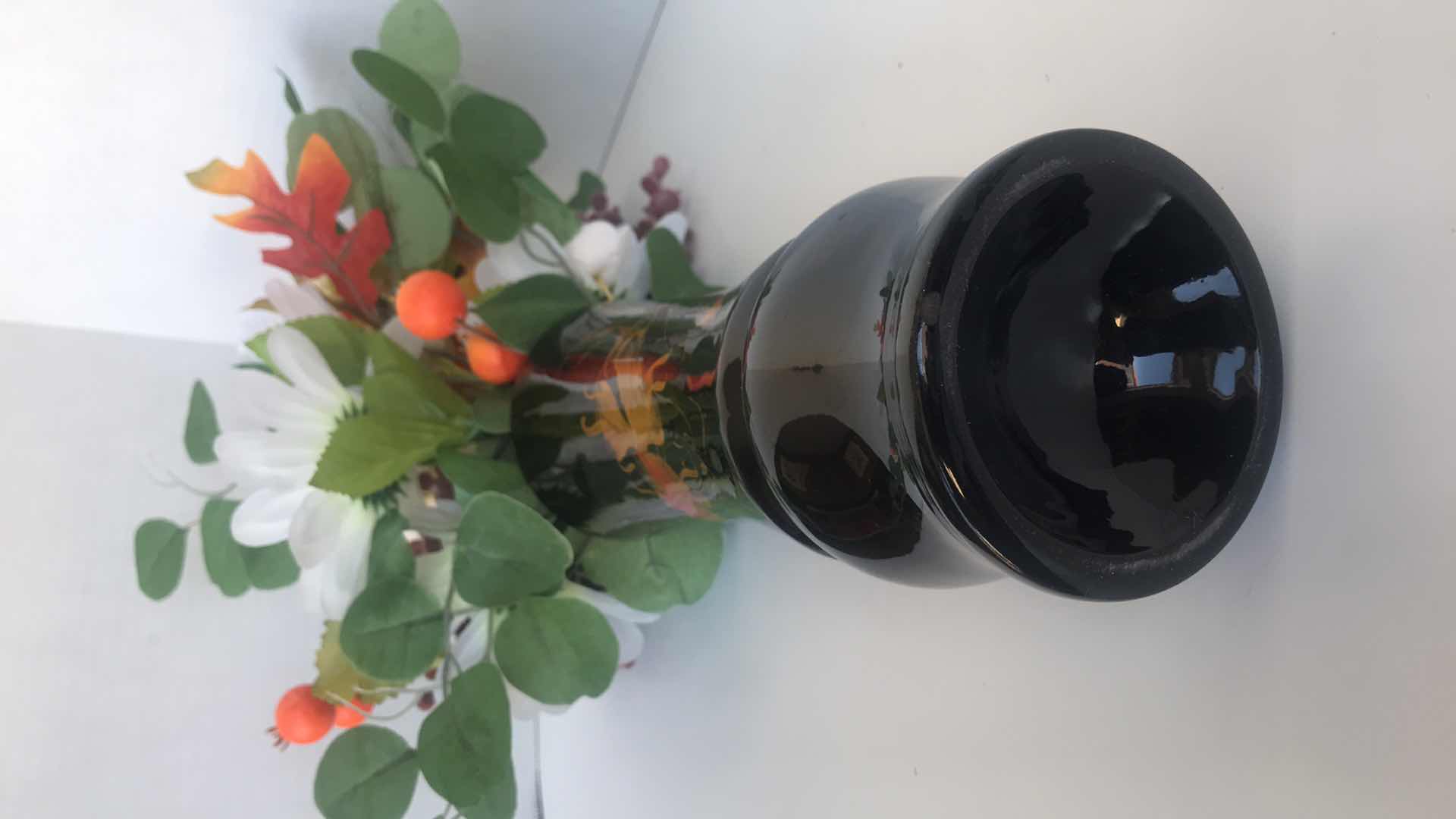 Photo 1 of ORIENTAL DESIGN, FISH ON BLACK PLASTIC VASE, WITH ARTIFICIAL FLORAL ARRANGEMENT