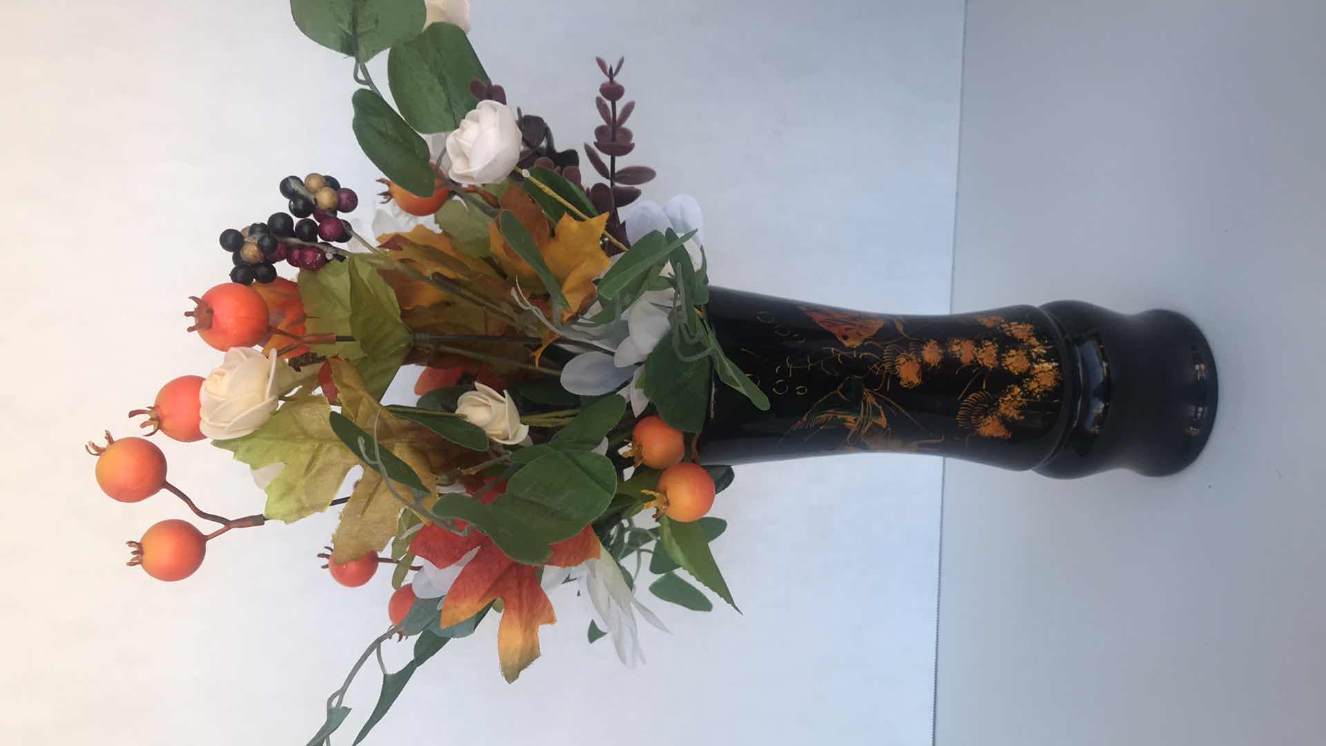 Photo 1 of ORIENTAL DESIGN, FISH ON BLACK PLASTIC VASE, WITH ARTIFICIAL FLORAL ARRANGEMENT