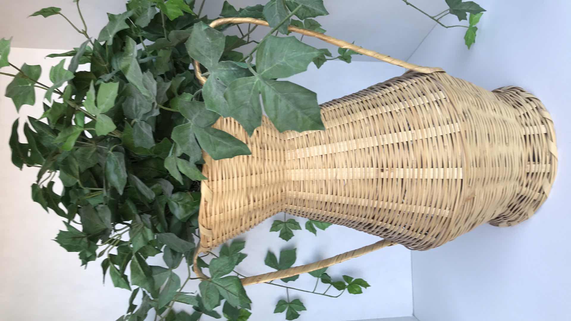 Photo 1 of LARGE WICKER VASE WITH ARTIFICIAL PLANT, 31” H WITH PLANT