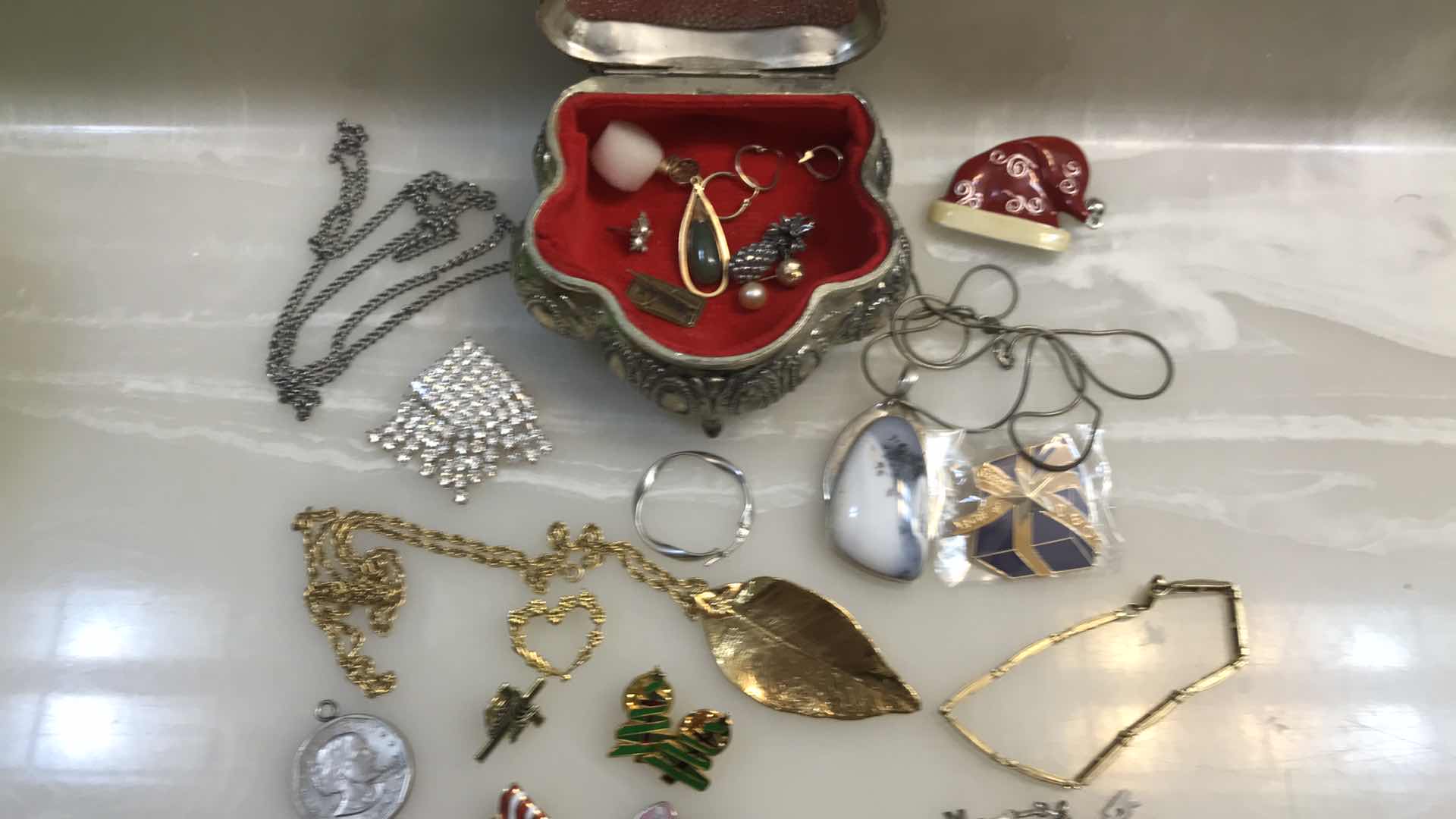 Photo 1 of ASSORTED JEWELRY IN SMALL SILVER BOX