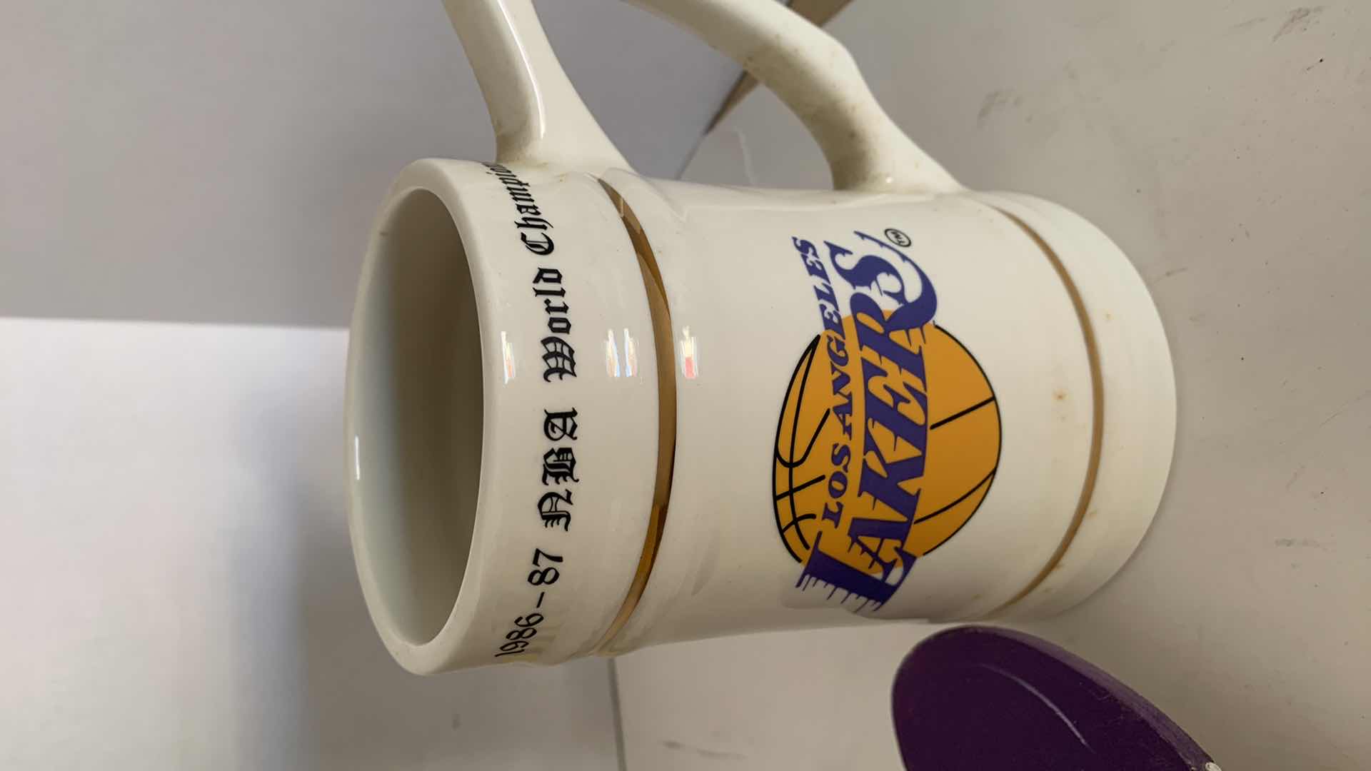 Photo 1 of UNAUTHENTICATED SHAQUILLE O’NEAL AUTOGRAPHED BASKETBALL WORLD CHAMPIONSHIP MUG AND LAWN MARKER