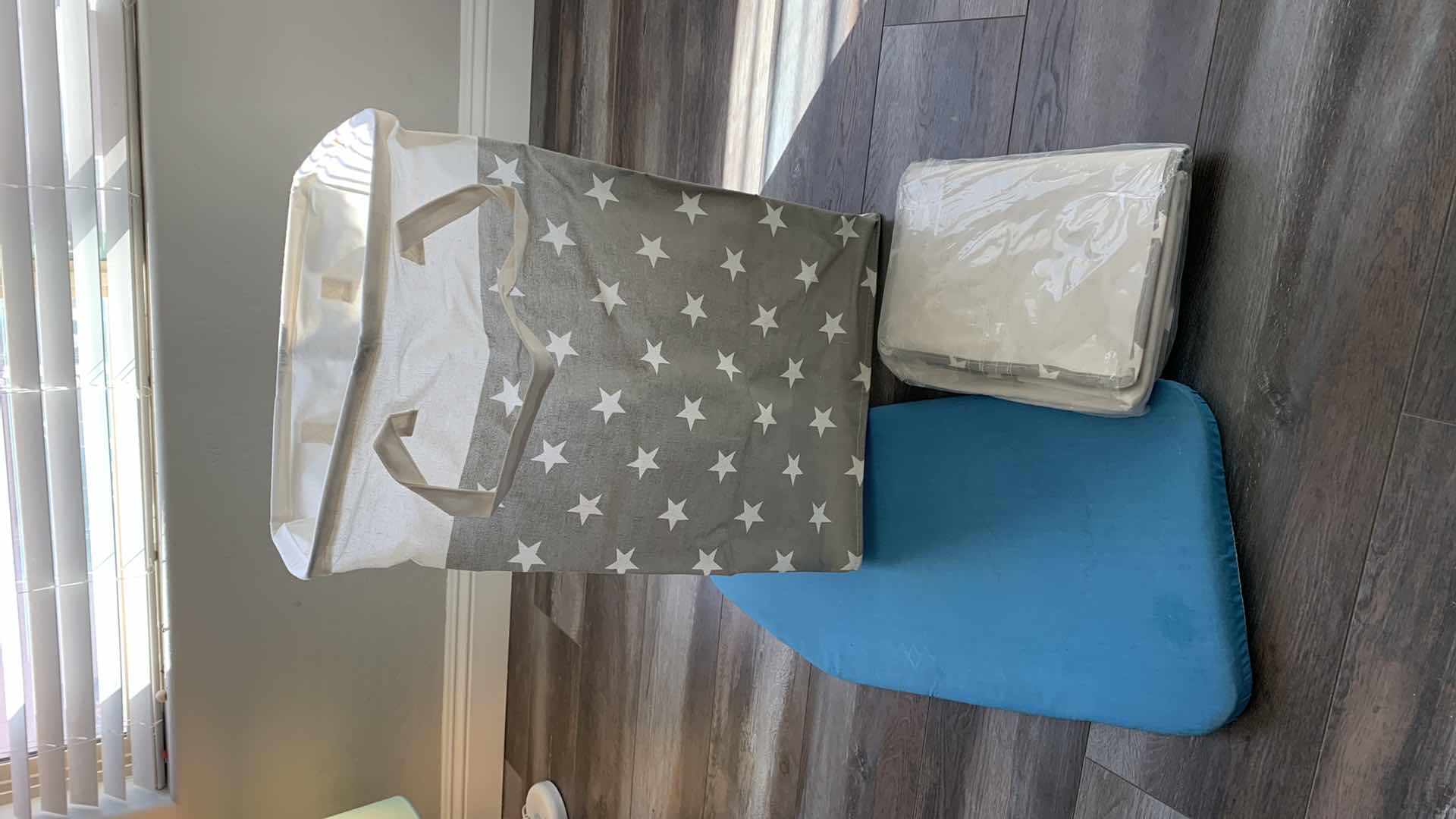 Photo 1 of 2-CLOTH LAUNDRY BAGS AND A SMALL IRONING BOARD