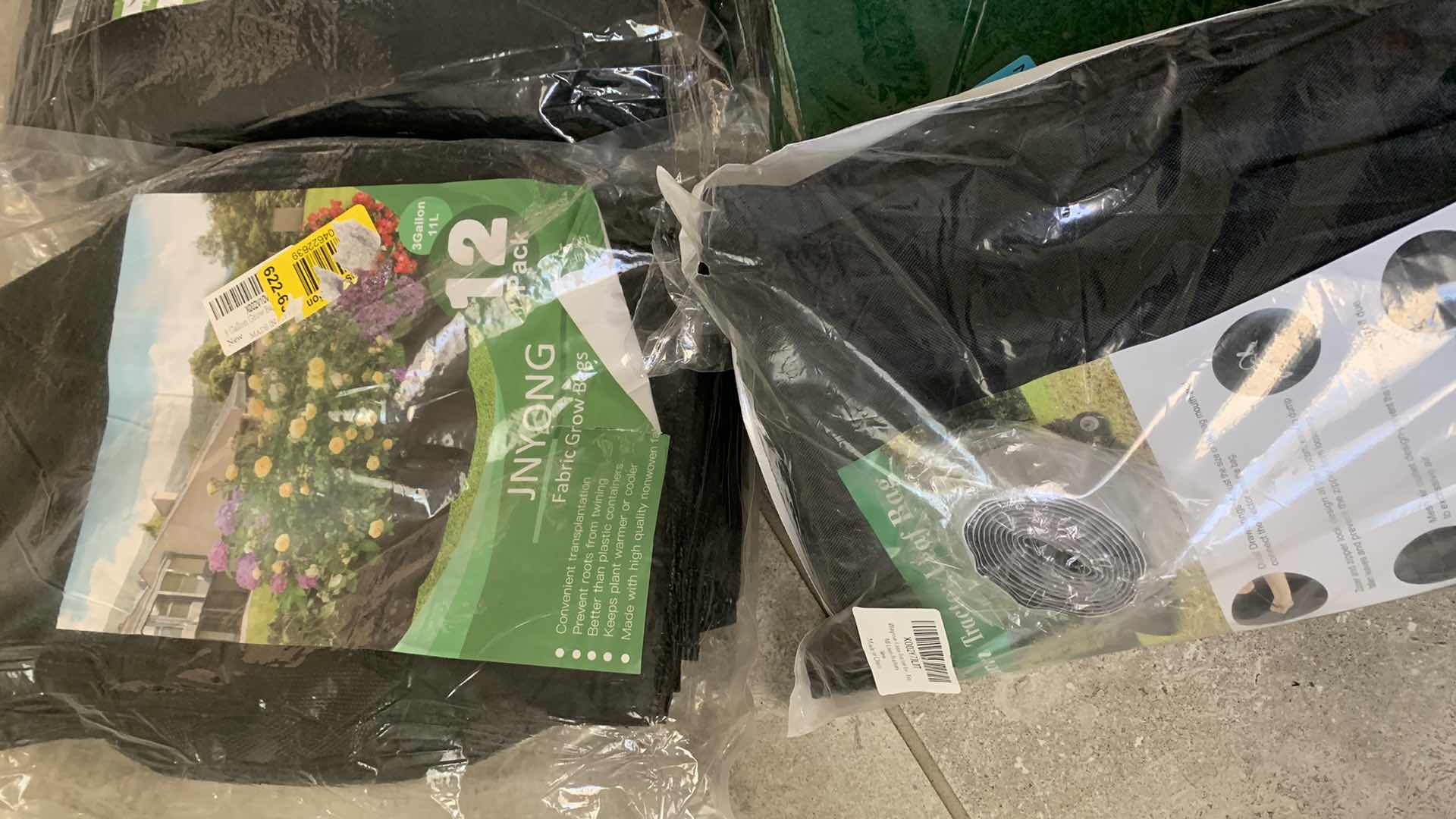 Photo 1 of 3-FABRIC PLANT GROW BAGS AND A LAWN TRACTOR LEAF BAG
