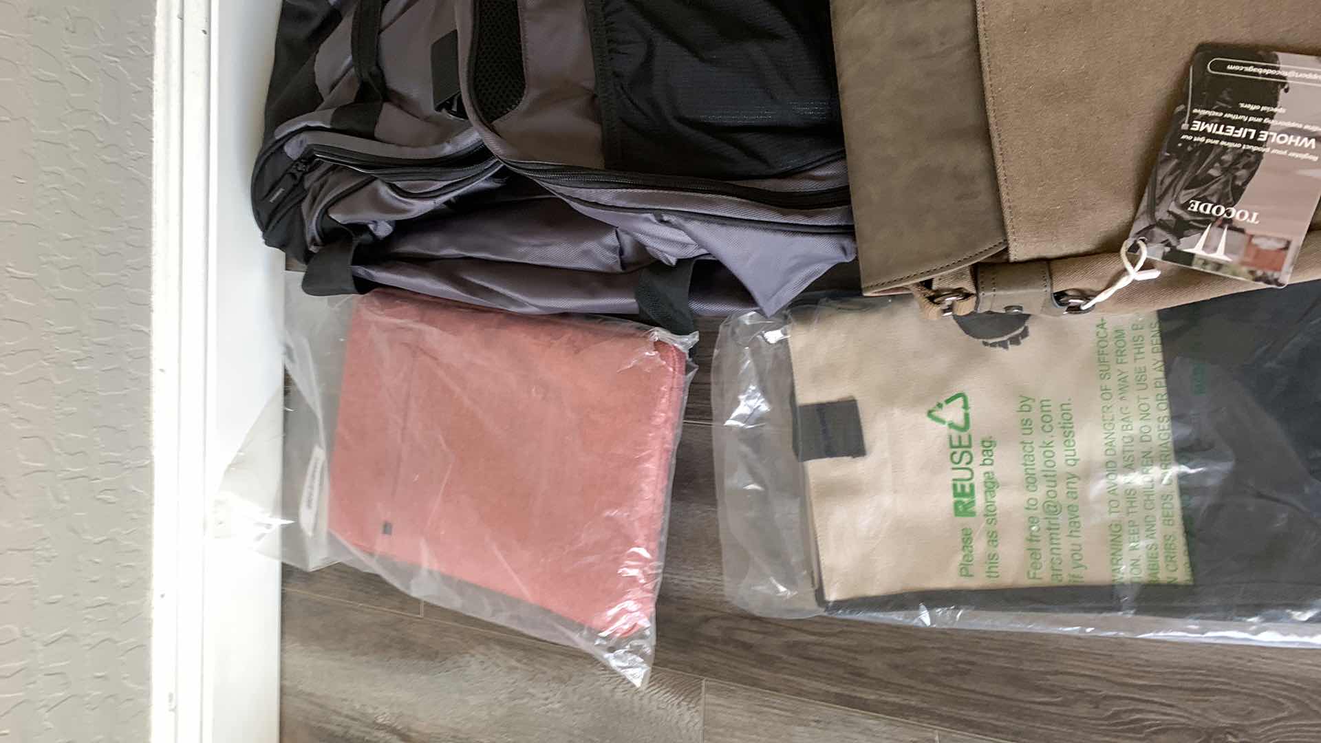 Photo 1 of BAGS, TABLET CASE , AND A BRIEFCASE
