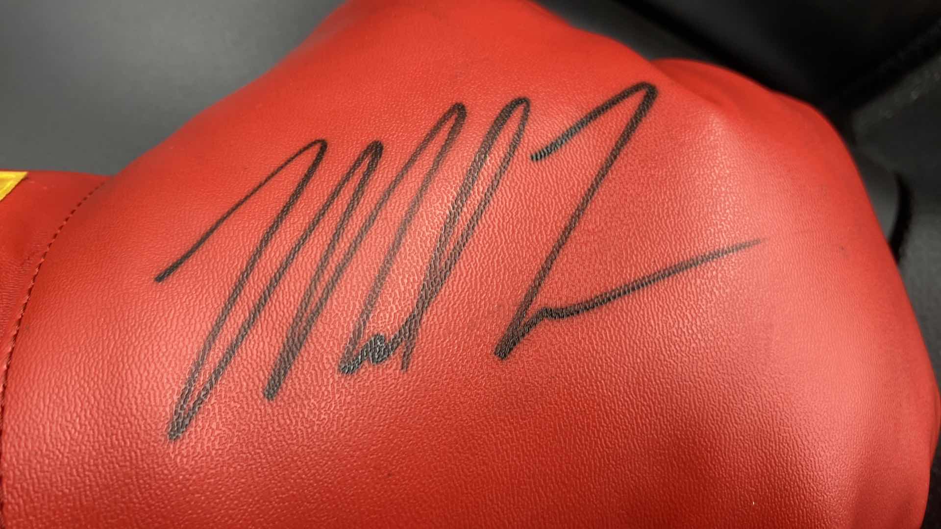 Photo 1 of MIKE TYSON AUTOGRAPHED BOXING GLOVE W COA