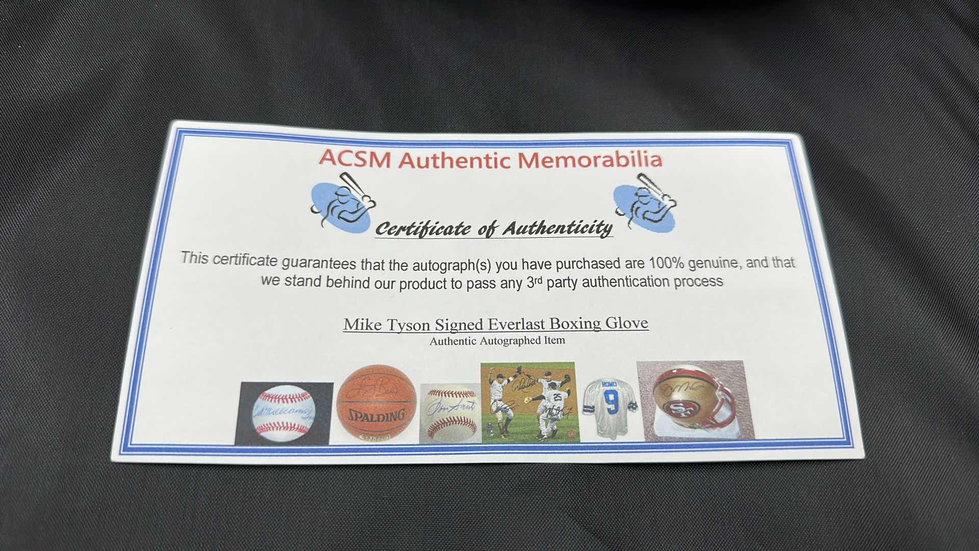 Photo 1 of MIKE TYSON AUTOGRAPHED EVERLAST BOXING GLOVE W COA