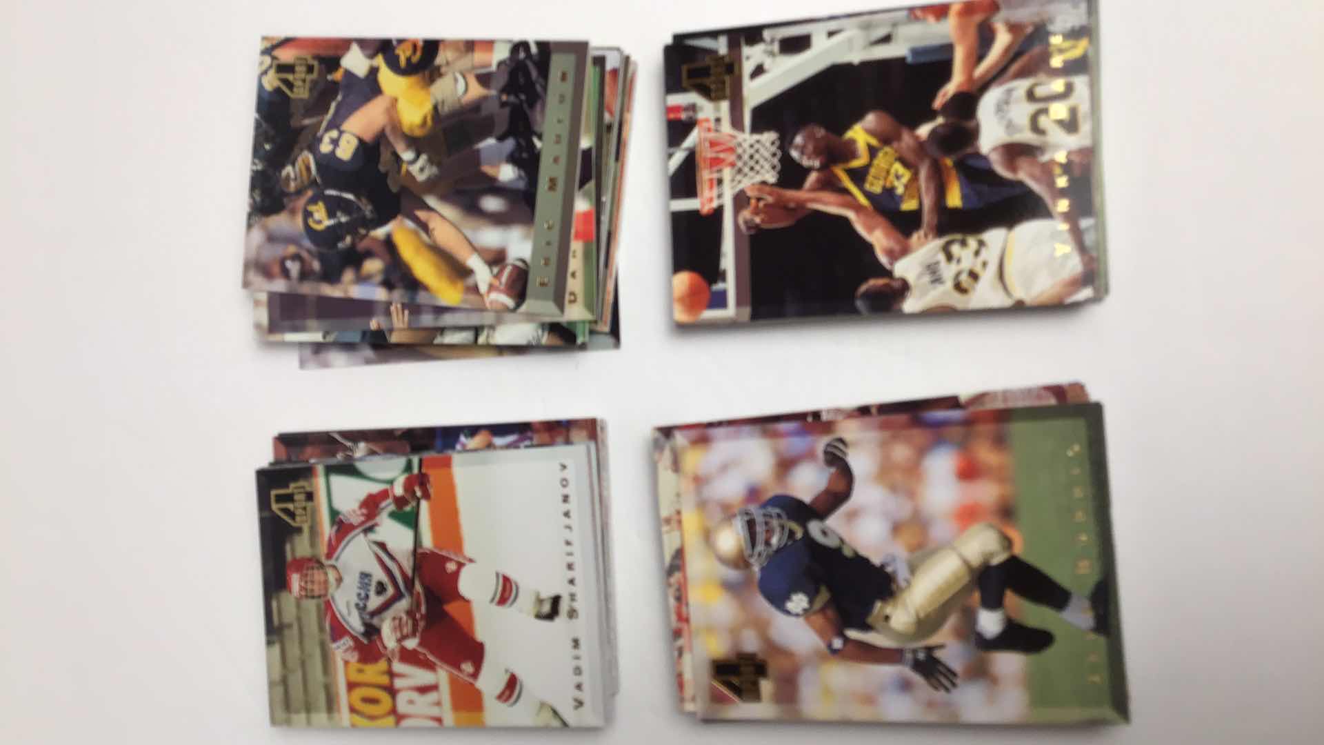 Photo 1 of $75 1994 FOUR SPORT COLLECTION MLB, NFL, NBA, NHL APPROX 200 CARDS (100 SEALED)*