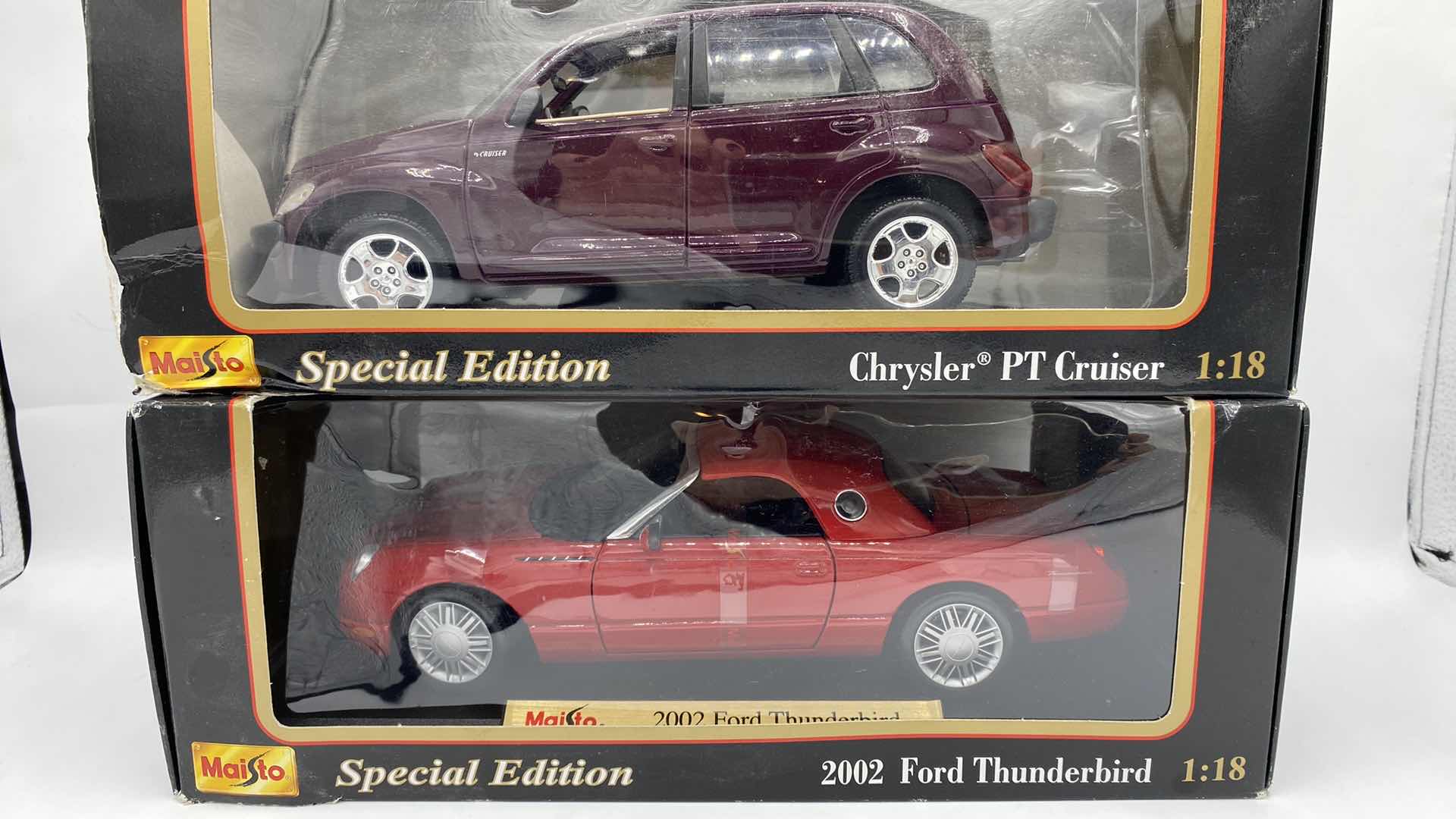 Photo 1 of PAIR OF MAISTO MODELS 2002 THUNDERBIRD & CHRYSLER PT CRUISER SCALE 1:18