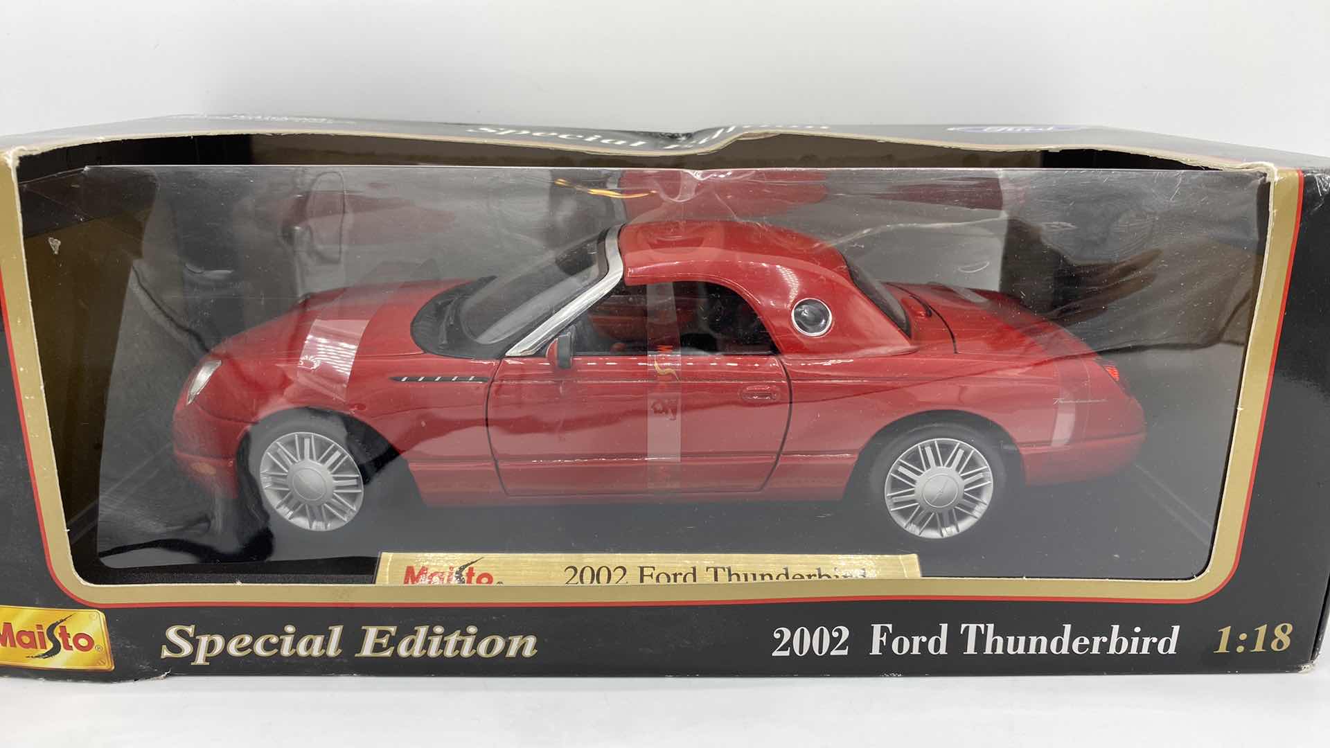 Photo 1 of PAIR OF MAISTO MODELS 2002 THUNDERBIRD & CHRYSLER PT CRUISER SCALE 1:18