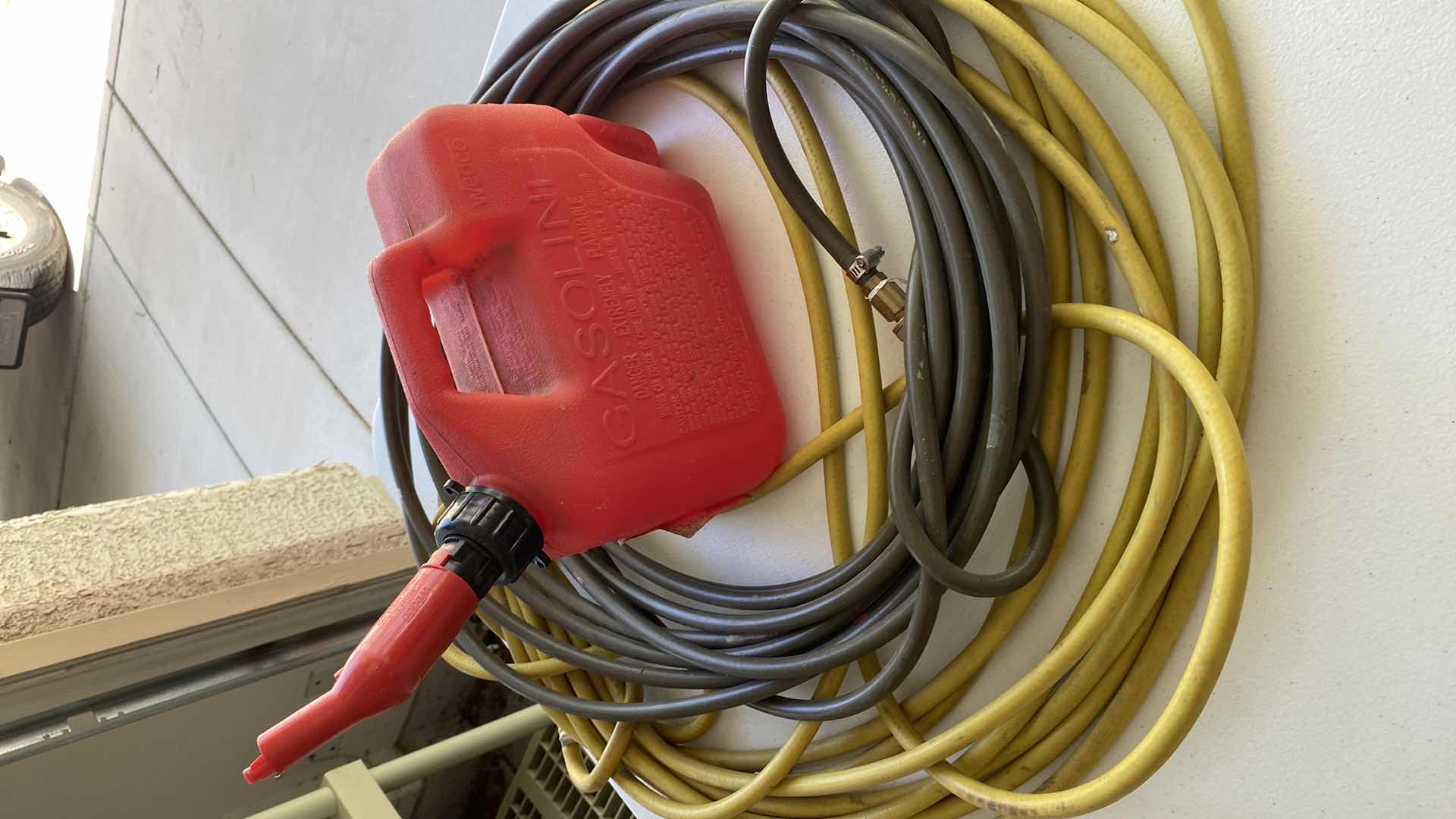 Photo 1 of 2 AIR HOSES AND 1.25 GALLON GAS CAN