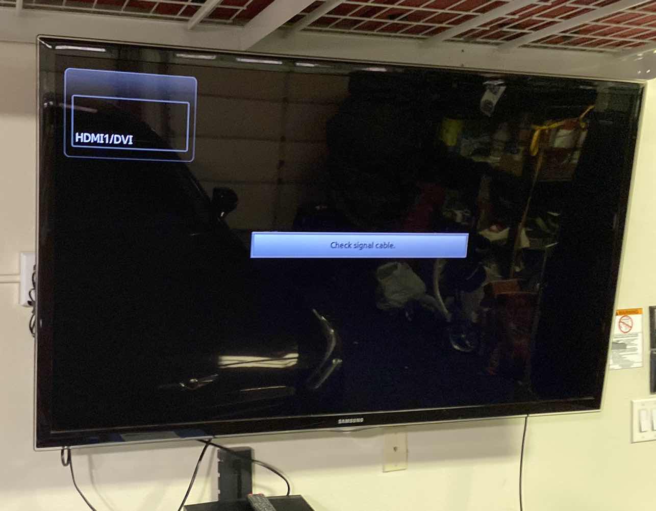 Photo 1 of SAMSUNG 60” TV WITH REMOTE AND SWIVEL WALL MOUNT, SAMSUNG DVD PLAYER. Buyer to remove from wall.