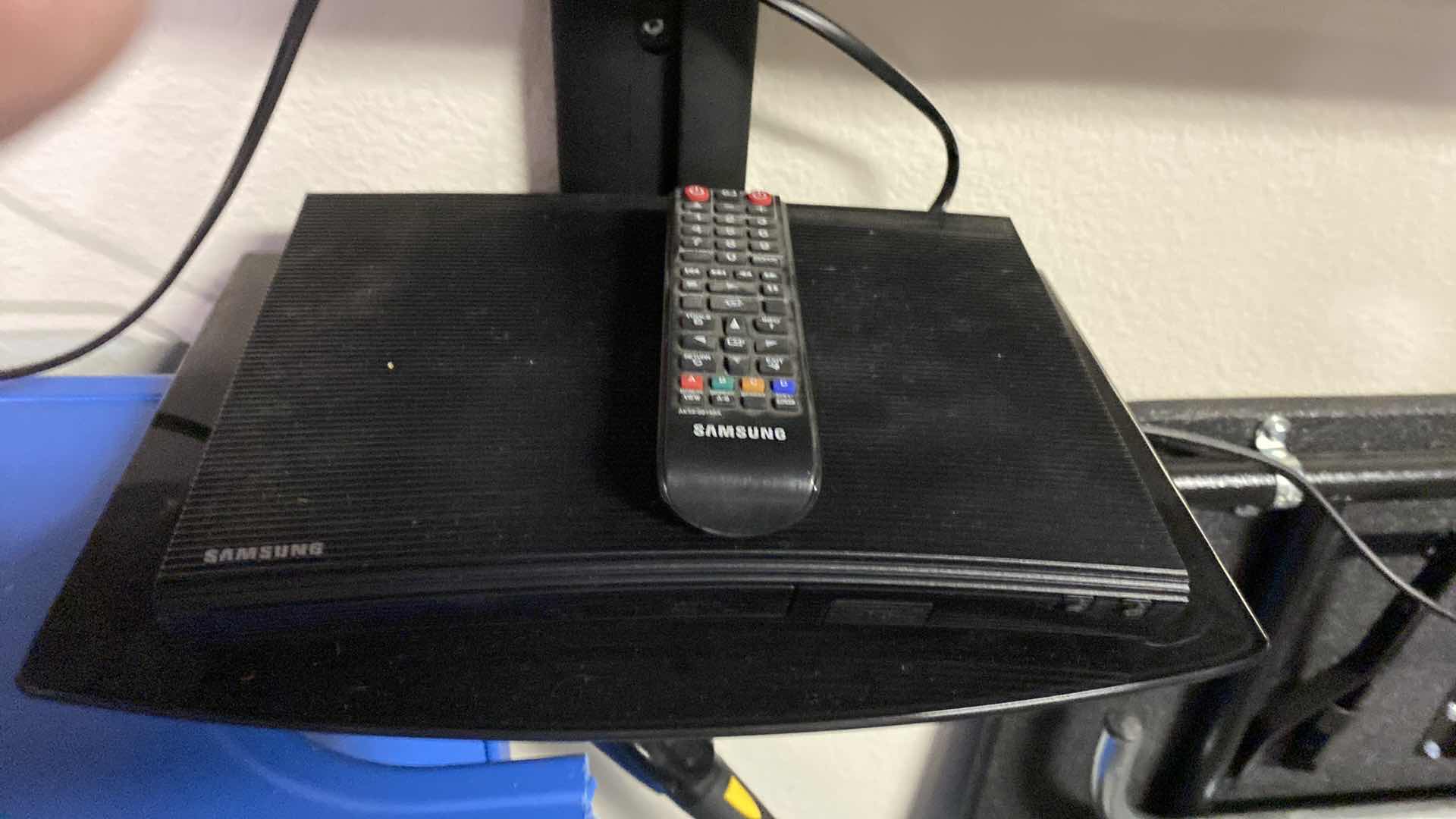 Photo 1 of SAMSUNG 60” TV WITH REMOTE AND SWIVEL WALL MOUNT, SAMSUNG DVD PLAYER. Buyer to remove from wall.