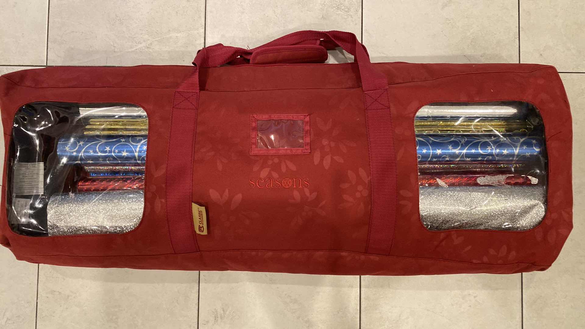 Photo 1 of NEW 20 ROLLS WRAPPING PAPER & 5 PARTIAL ROLLS INCLUDES STORAGE BAG