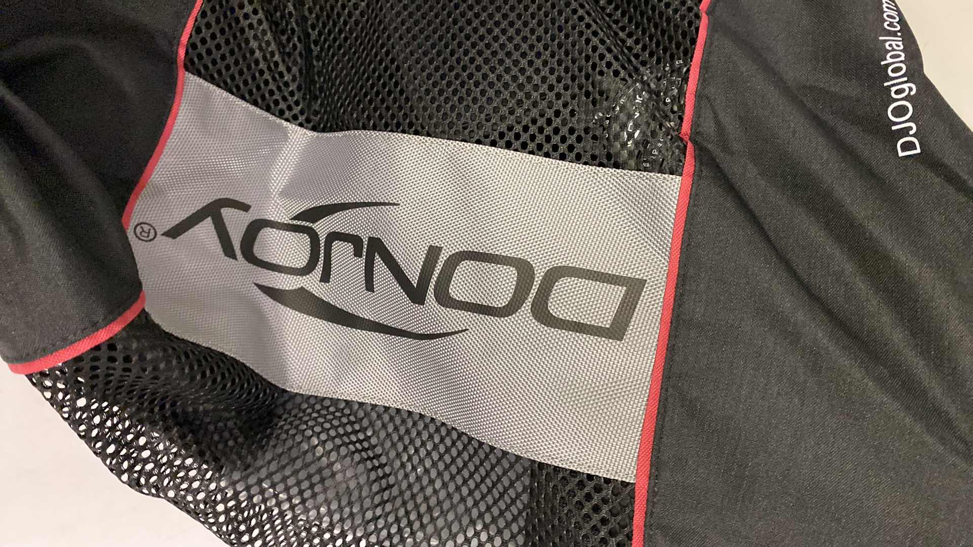 Photo 1 of DONJOY ADJUSTABLE KNEE BRACE WITH ACCESSORIES AND CARRY BAG