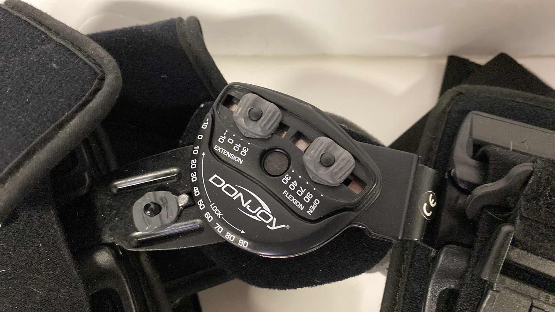 Photo 1 of DONJOY ADJUSTABLE KNEE BRACE WITH ACCESSORIES AND CARRY BAG