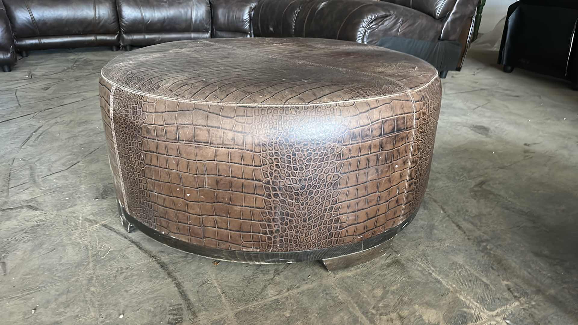 Photo 1 of ROUND LEATHER OTTOMAN 35” x 16”