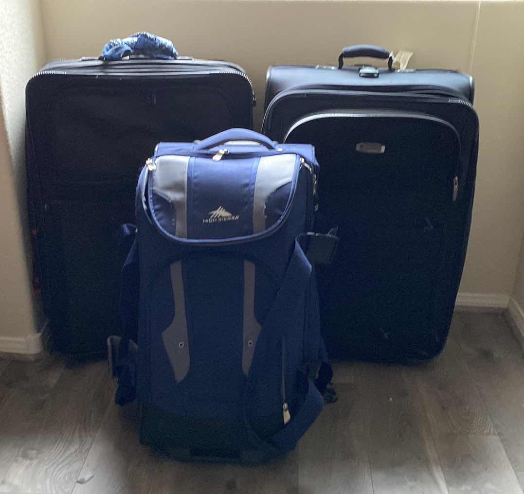 Photo 1 of 2 LARGE SUITCASES AND 1 ROLLING DUFFLE