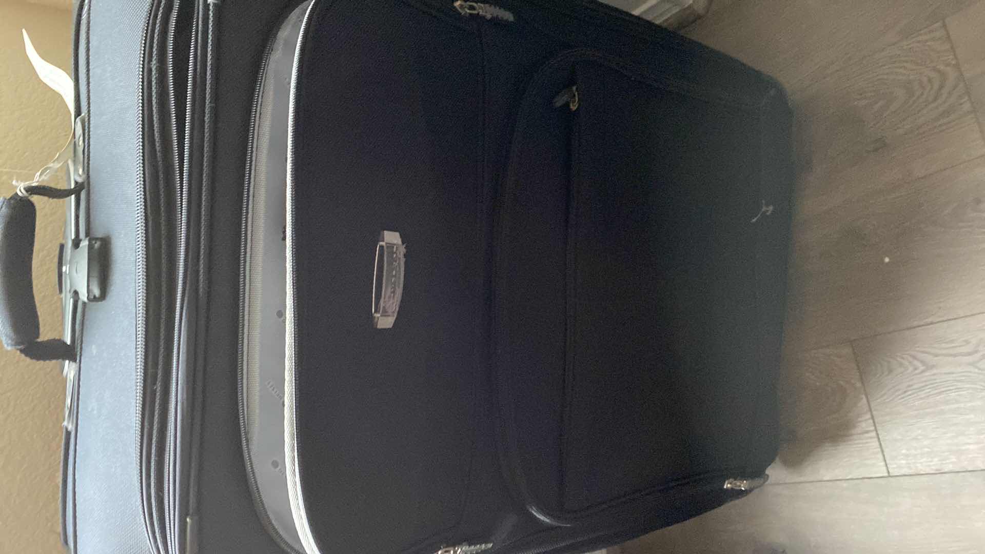 Photo 1 of 2 LARGE SUITCASES AND 1 ROLLING DUFFLE
