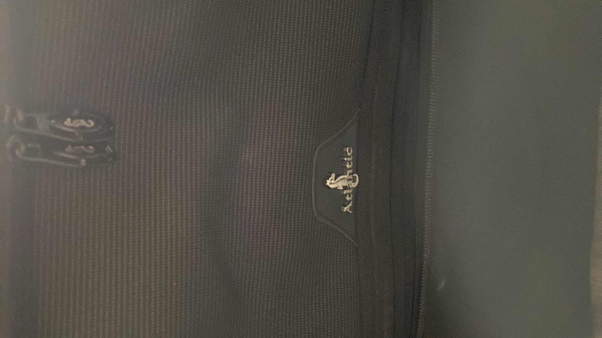 Photo 1 of 2 LARGE SUITCASES AND 1 ROLLING DUFFLE