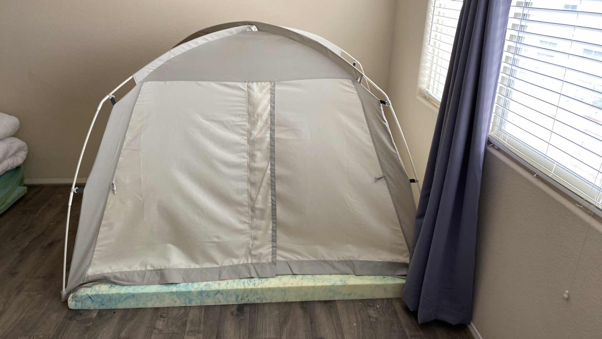 Photo 1 of IDOGEN TENT AND FOAM PAD. TENT HAS NO FLOOR