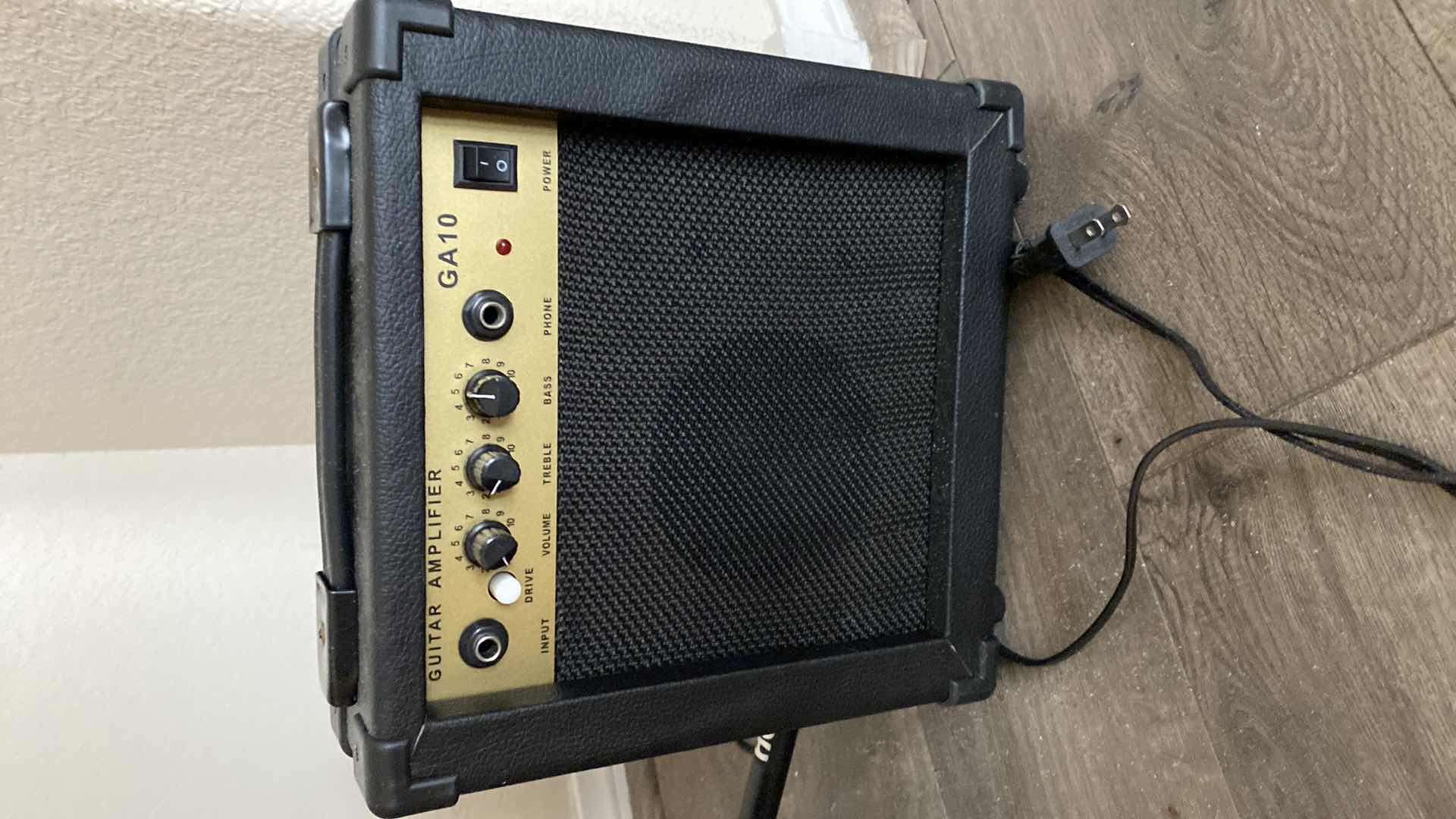 Photo 1 of 6 STRING GUITAR WITH STAND AND AMPLIFIER