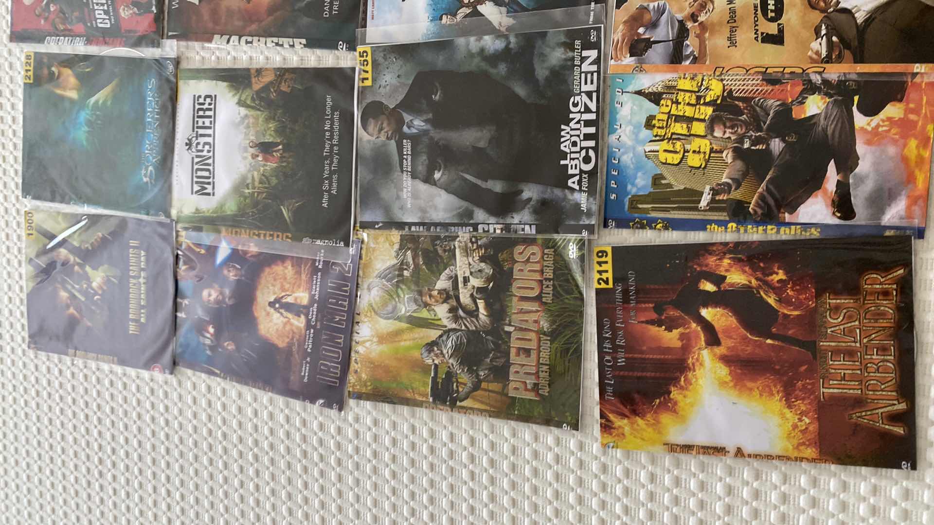 Photo 2 of ASSORTED DVDS AND SONY WALKMAN AND MISC CORDS