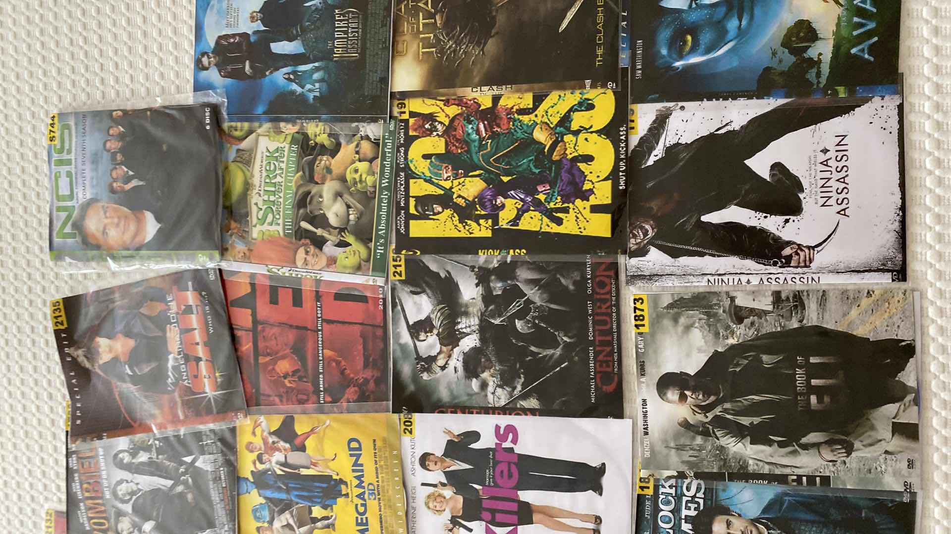 Photo 4 of ASSORTED DVDS AND SONY WALKMAN AND MISC CORDS