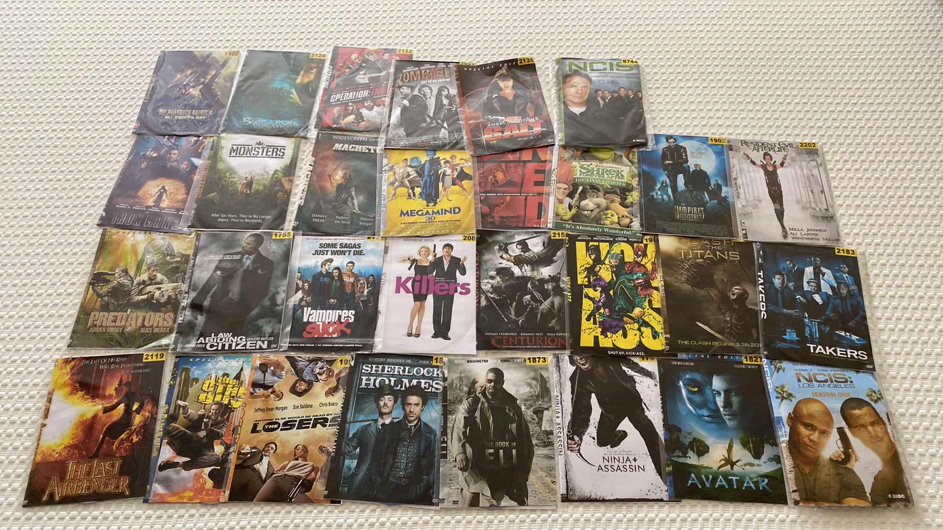 Photo 1 of ASSORTED DVDS AND SONY WALKMAN AND MISC CORDS