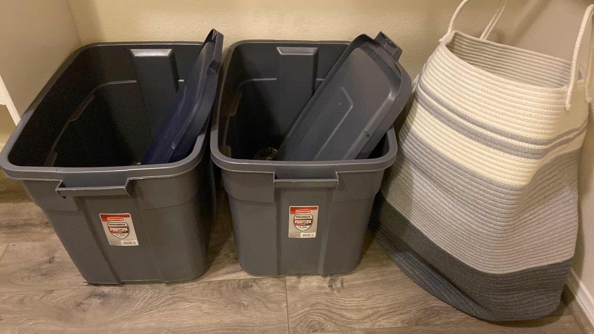 Photo 1 of 2 - 18 GALLON TIRES WITH LIDS AND LAUNDRY BASKET WITH HANGERS