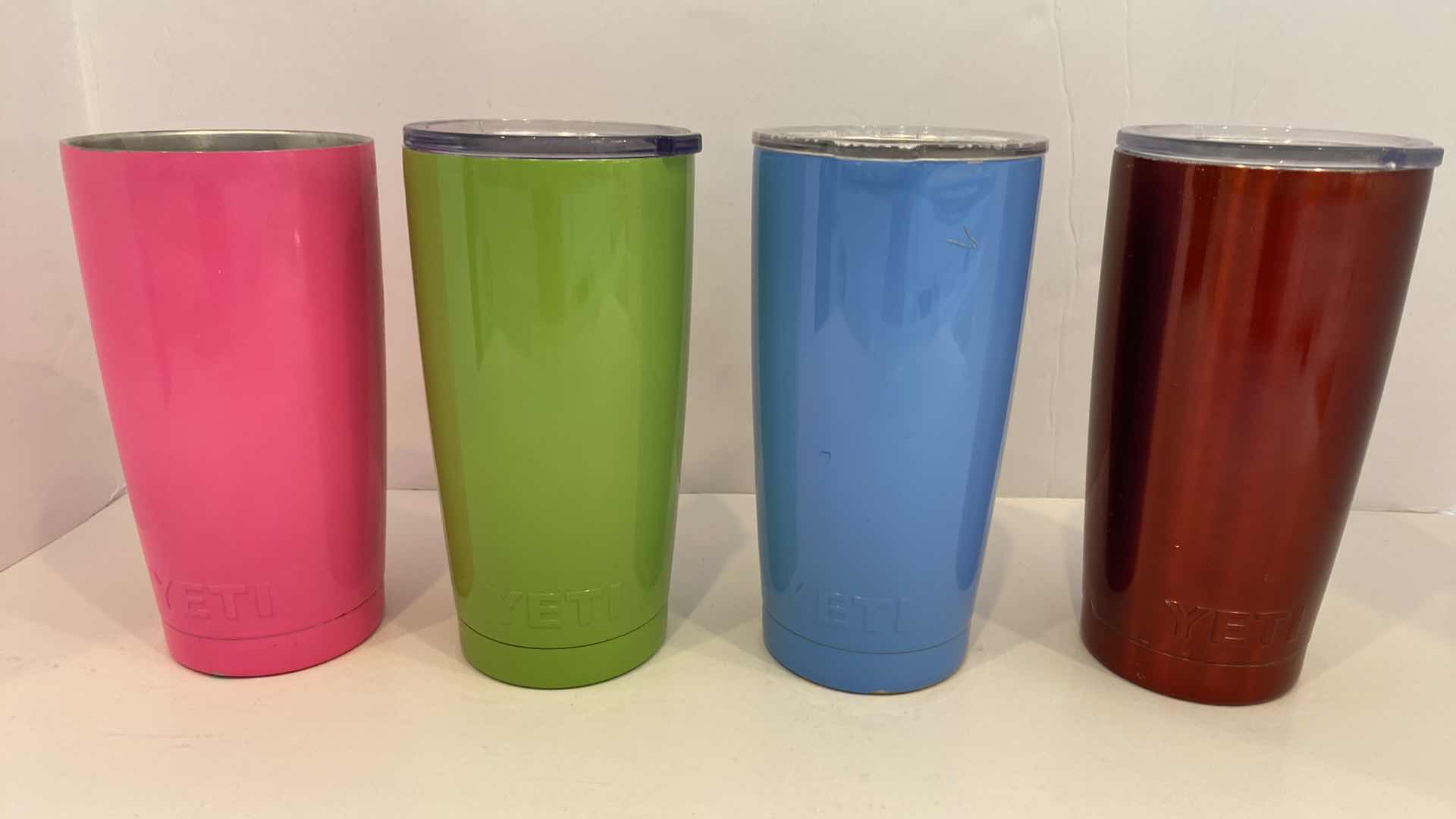 Photo 1 of CONTENTS OF KITCHEN CABINET - 4 YETI INSULATED CUPS - ONE LID MISSING