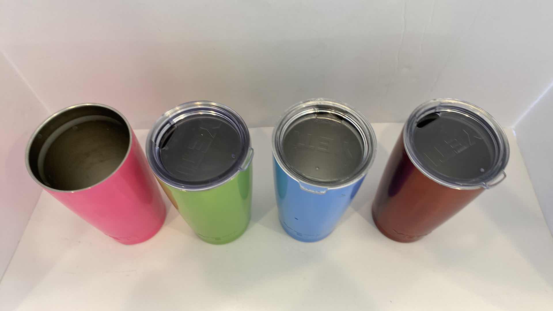 Photo 1 of CONTENTS OF KITCHEN CABINET - 4 YETI INSULATED CUPS - ONE LID MISSING