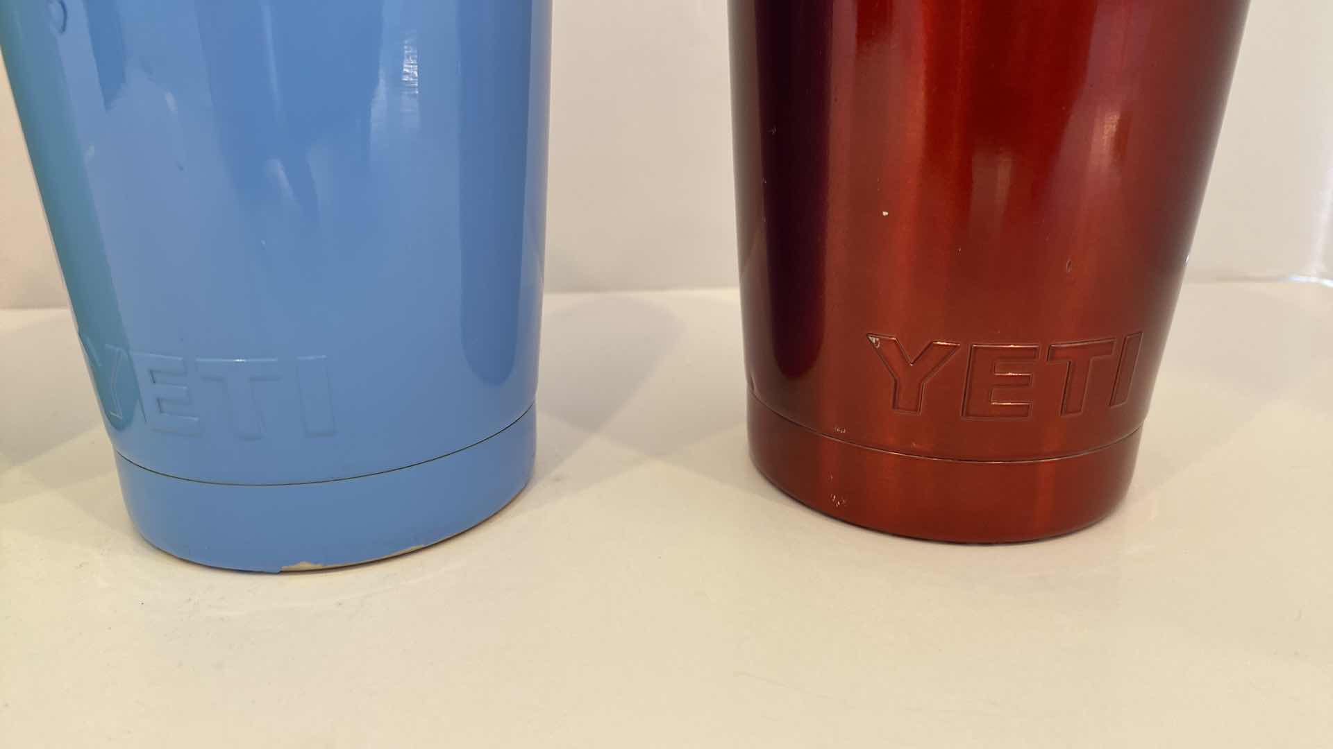 Photo 1 of CONTENTS OF KITCHEN CABINET - 4 YETI INSULATED CUPS - ONE LID MISSING