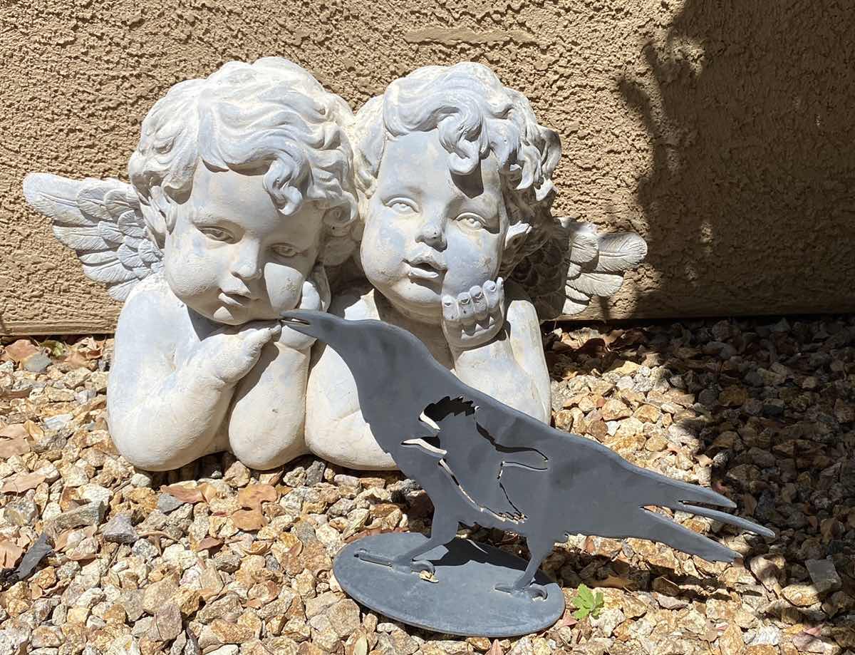 Photo 1 of ANGLE RESIN YARD ART 27” X 17” AND METAL BIRD