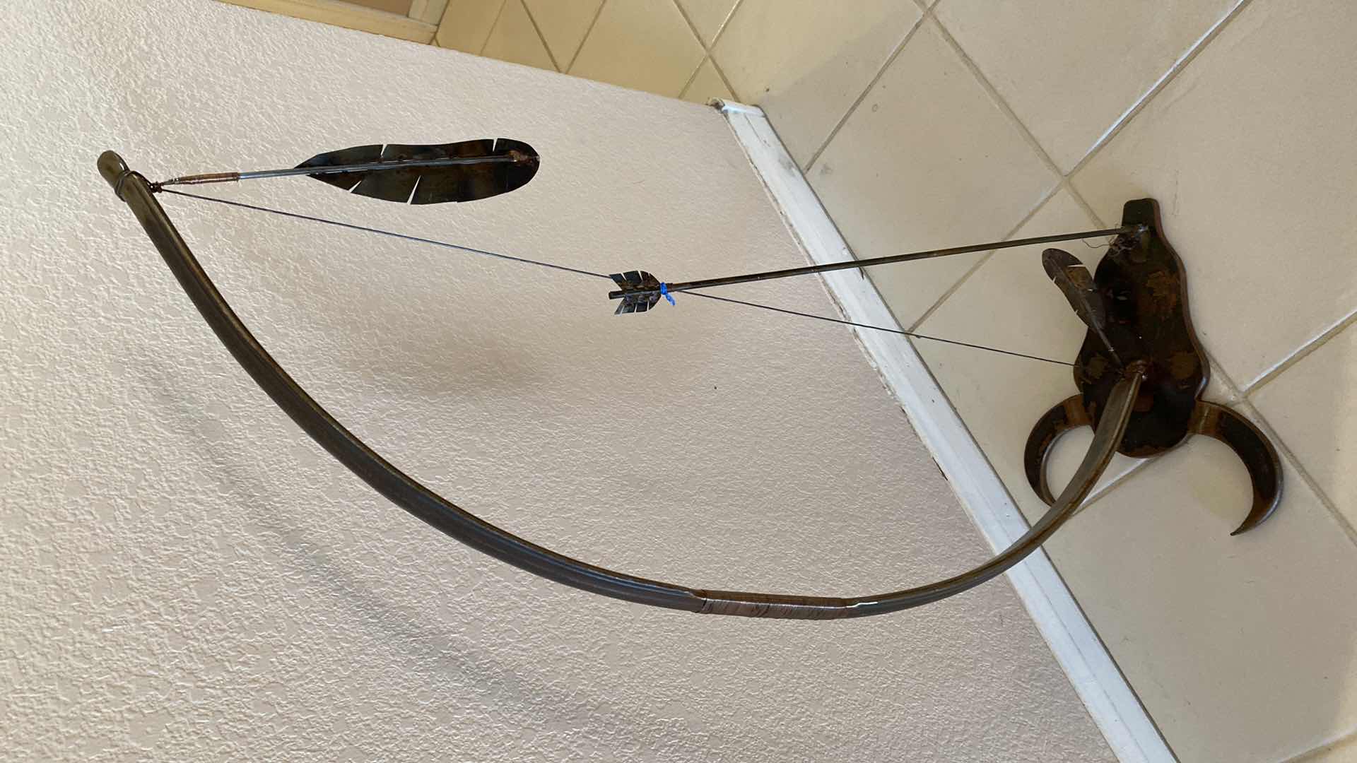 Photo 1 of HANDCRAFTED UNIQUE METAL BOW AND ARROW WITH STEER HEAD BASE H 38”