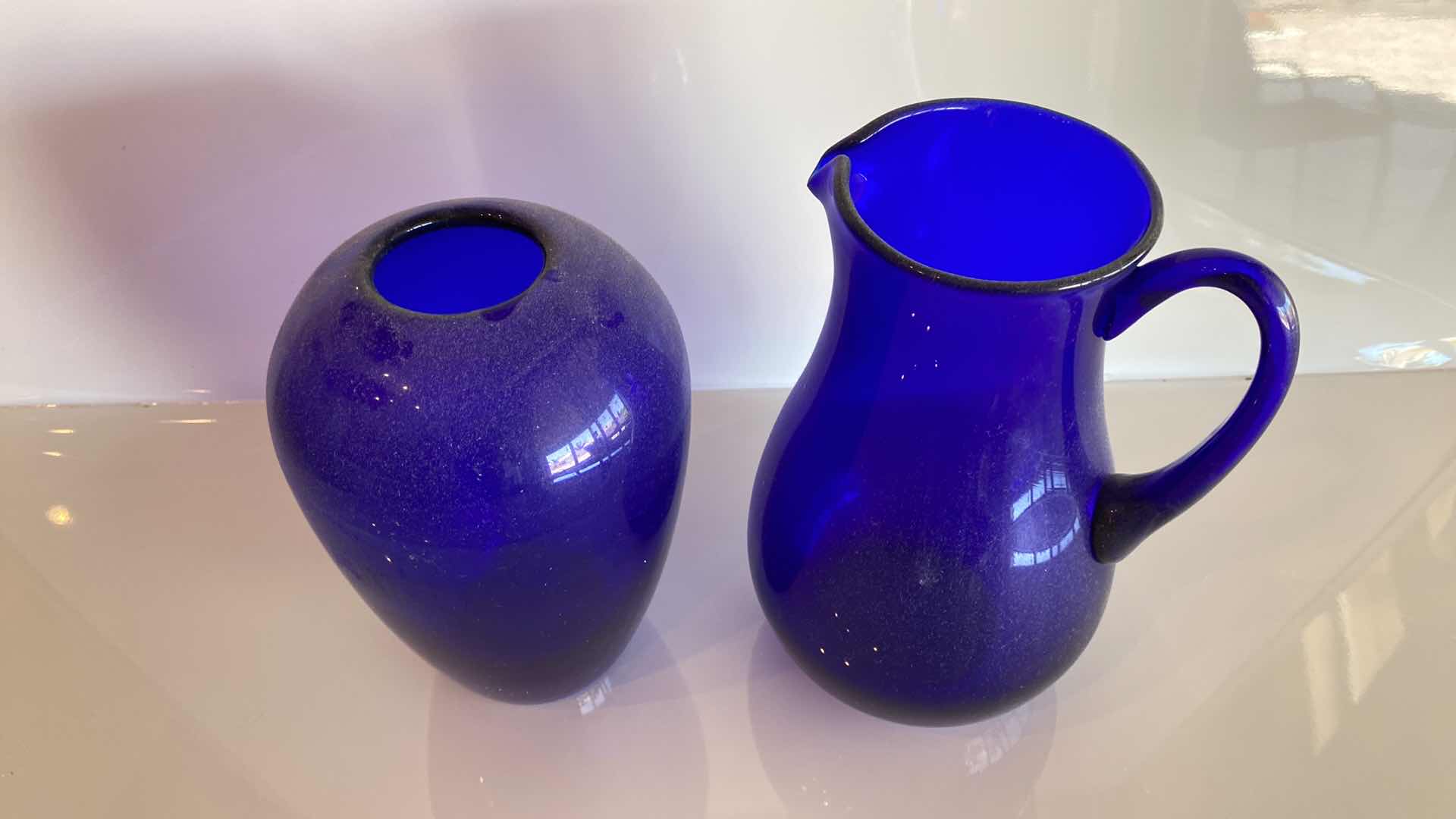 Photo 1 of BLUE GLASS VASE AND PITCHER H 9 1/2“