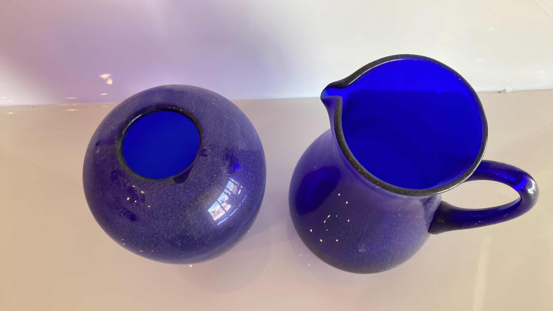 Photo 1 of BLUE GLASS VASE AND PITCHER H 9 1/2“