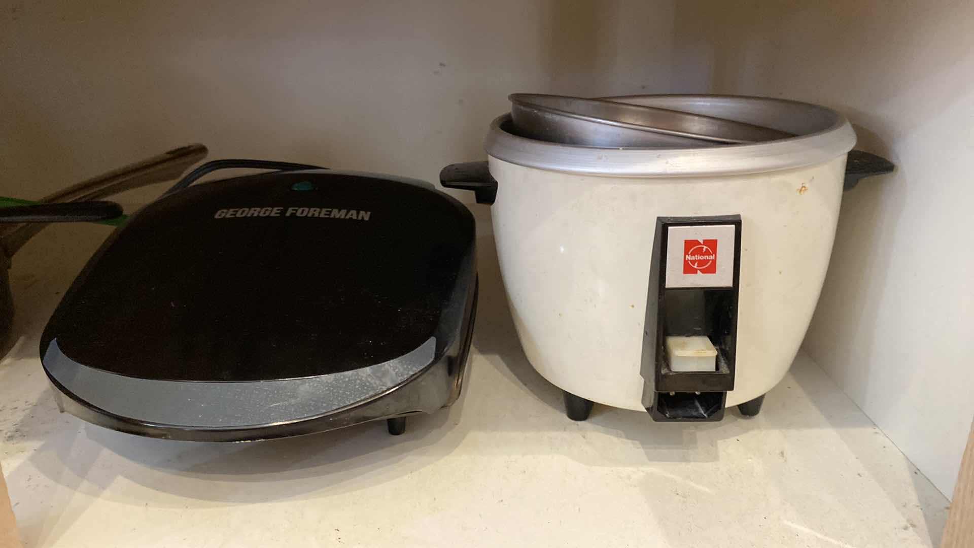 Photo 1 of CONTENTS OF KITCHEN CABINET PANS RICE COOKER AND MORE