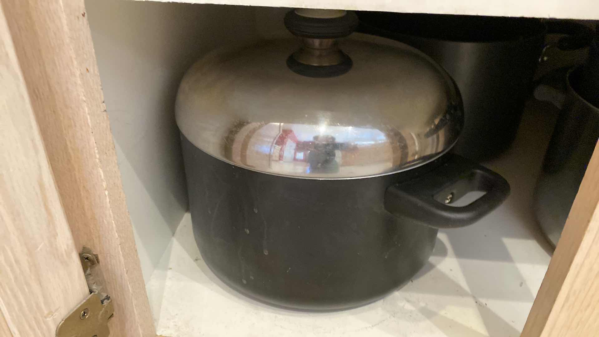 Photo 1 of CONTENTS OF KITCHEN CABINET POTS AND PANS