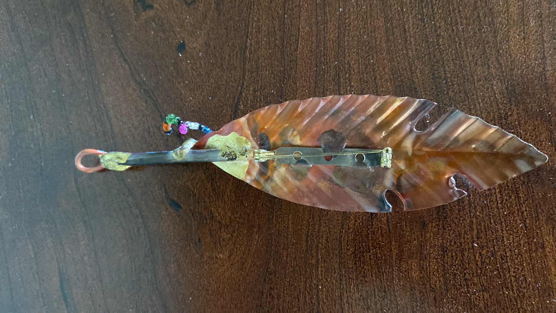 Photo 1 of METAL FEATHER PIN AND PULSAR WATCH