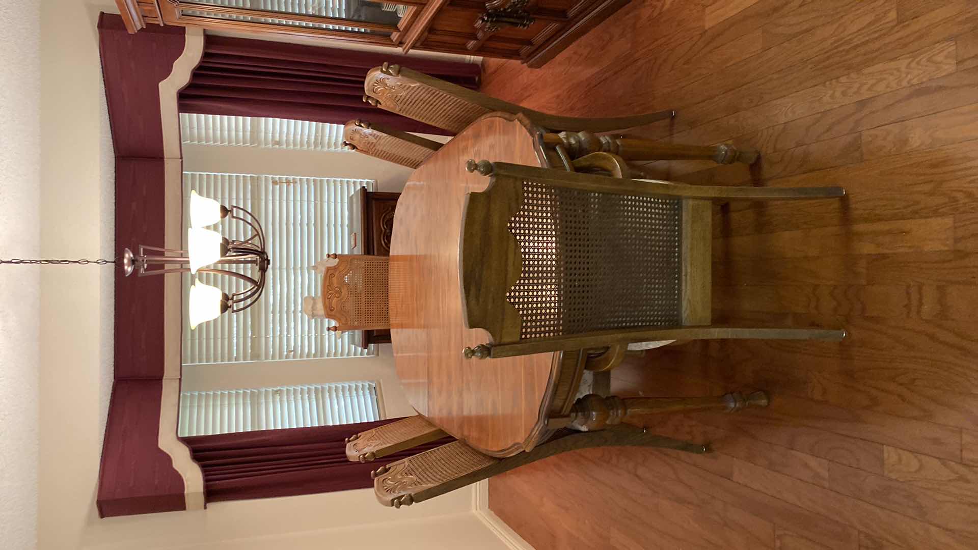 Photo 1 of OAK DINING TABLE WITH 6 CANE BACK CHAIRS MEASUREMENT INCLUDES 18” LEAF 80” x 42” H 30” INCLUDES TABLE PADS