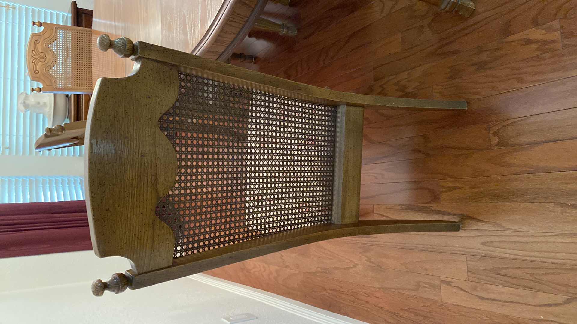 Photo 1 of OAK DINING TABLE WITH 6 CANE BACK CHAIRS MEASUREMENT INCLUDES 18” LEAF 80” x 42” H 30” INCLUDES TABLE PADS