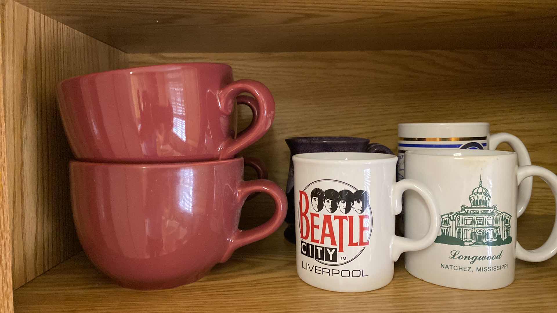 Photo 1 of CONTENTS OF CABINET COFFEE CUPS