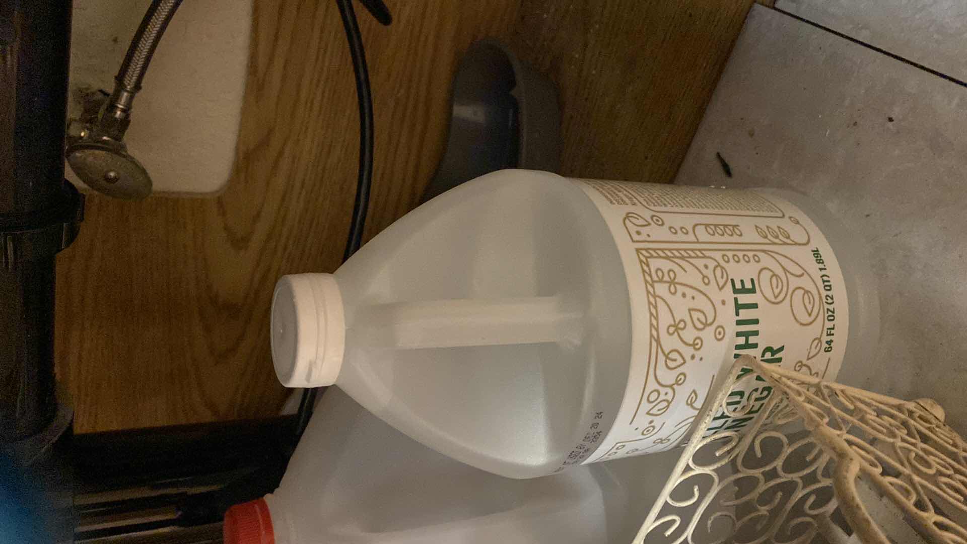 Photo 1 of CONTENTS OF KITCHEN CABINET UNDER SINK CUTTING BOARDS BAKEWARE AND MORE