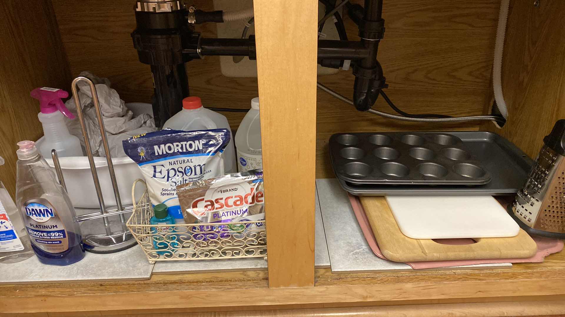 Photo 1 of CONTENTS OF KITCHEN CABINET UNDER SINK CUTTING BOARDS BAKEWARE AND MORE