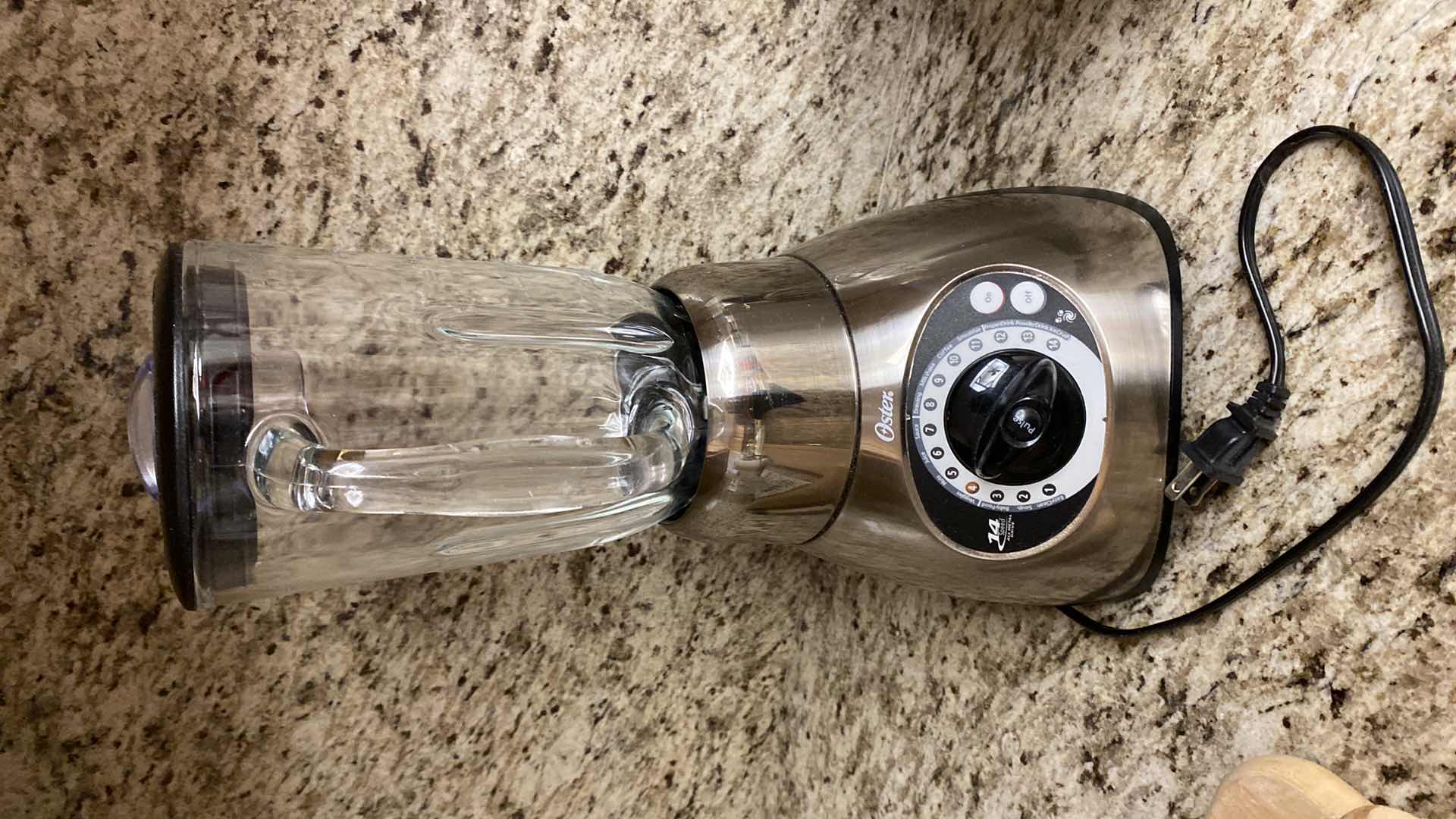 Photo 1 of CONTENTS KITCHEN CABINET OSTER BLENDER