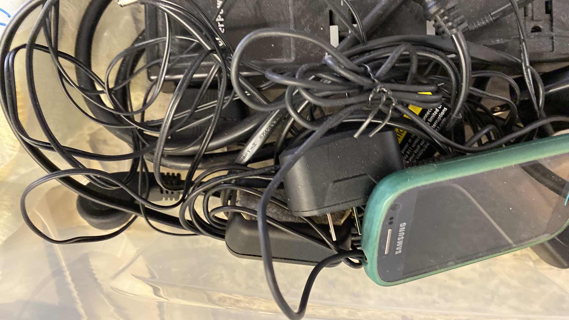Photo 3 of SAMSUNG PHONE AND ASSORTED CORDS AND POWER STRIP - TOTE NOT INCLUDED