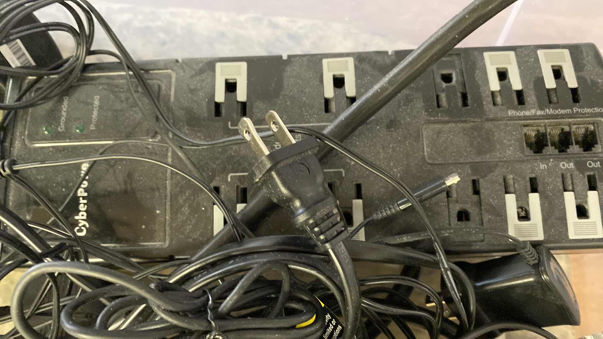 Photo 2 of SAMSUNG PHONE AND ASSORTED CORDS AND POWER STRIP - TOTE NOT INCLUDED