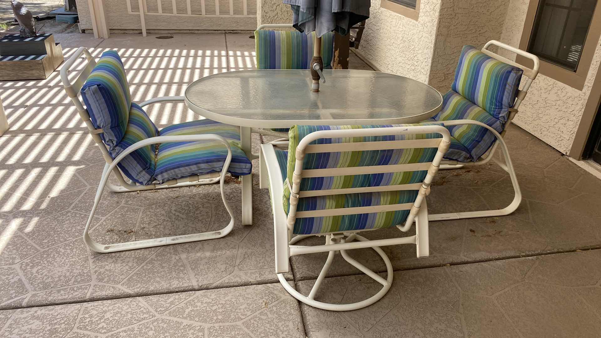 Photo 6 of ALUMINUM PATIO TABLE  54“ x 35“ H 27 1/2 “WITH GLASS TOP AND 4 CHAIRS AND UMBRELLA